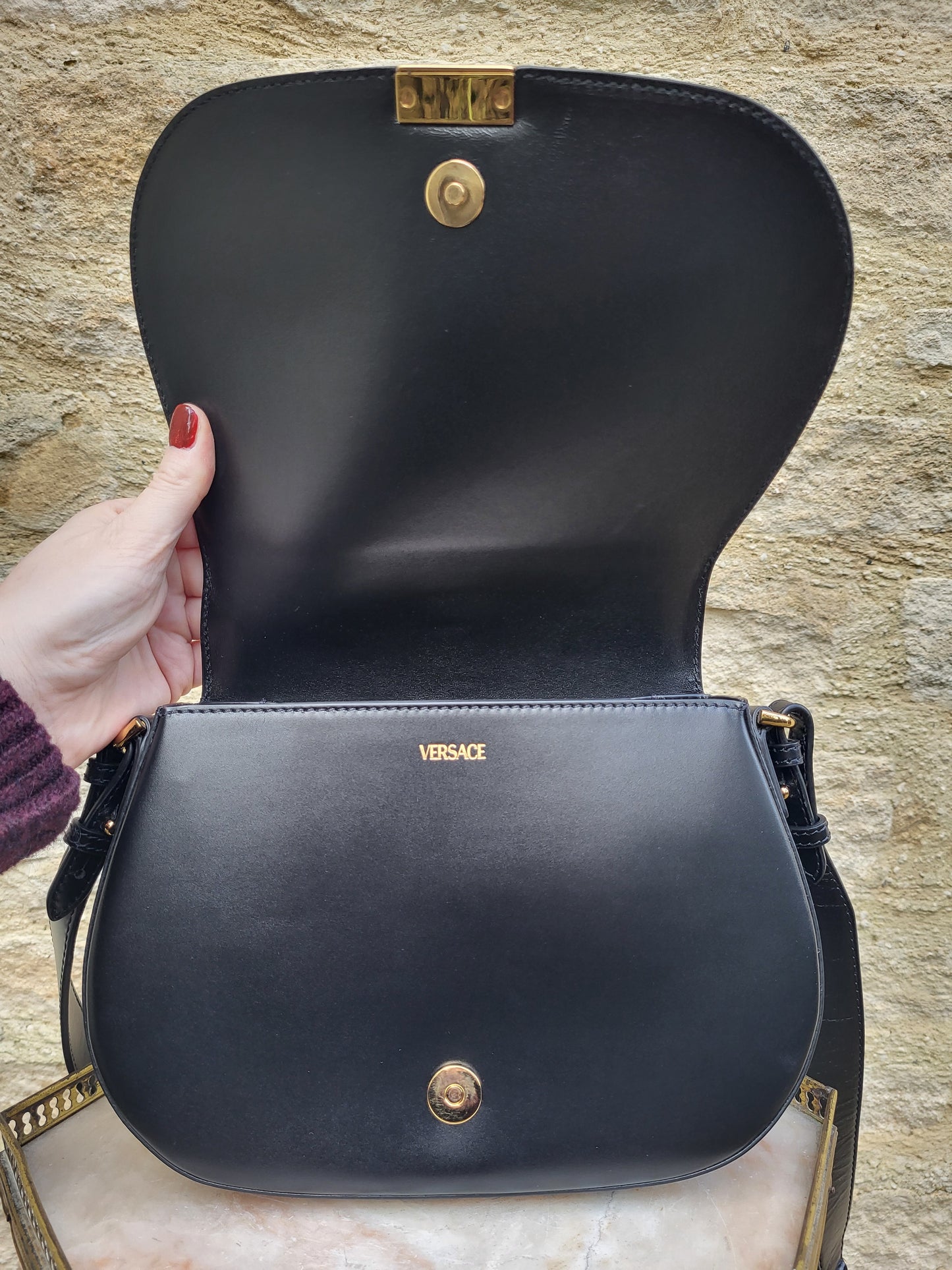 Versace Greca Goddess black leather crossbody bag, brand new with tags. Close up of inside of bag.